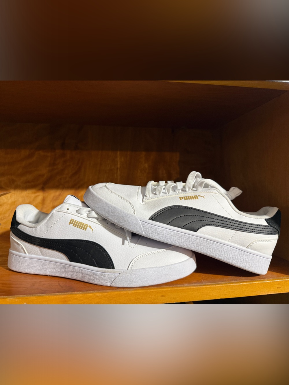 Puma White Sneakers with Black Stripe and Gold Logo